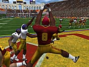 A USC player enacts a two-hand grab for a touchdown.