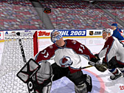 In NHL 2003, goaltenders react to the puck better than ever. Here, Patrick Roy follows the bouncing puck. 