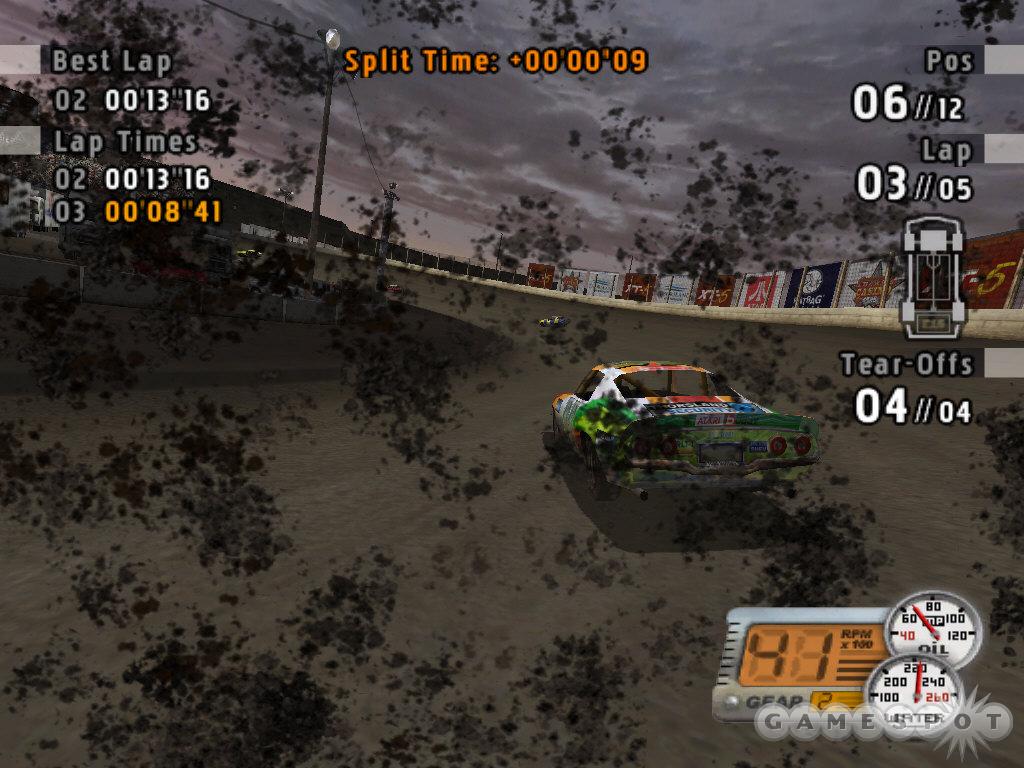 His field of vision seriously impeded by mud blobs, a Pro Stock driver picks his way carefully through one more turn.