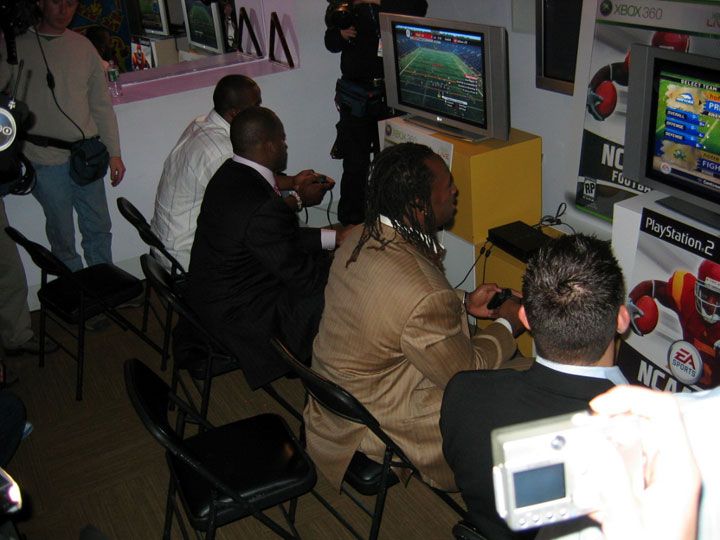 From left, Mario Williams, Vince Young, Vernon Davis, and Anthony Fasano check out NCAA 07.