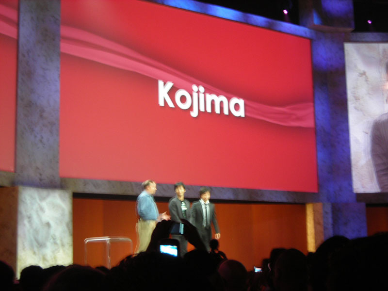 Kojima(center), Tretton, and a translator on stage.