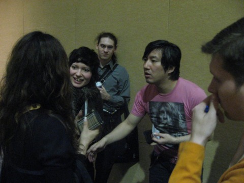 Suda meets with fans after his presentation.