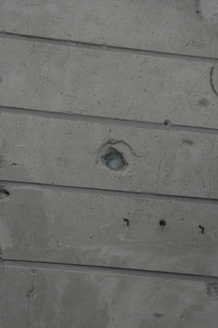 Detail of bullet damage on a house in Foy, Belgium. This damage was produced during the 506th Parachute Infantry Regiment, 101st Airborne Division attack on German forces occupying the town on January 13, 1945.