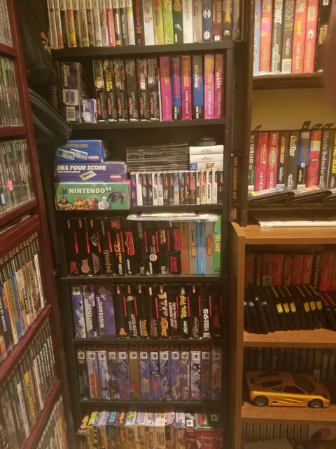 Gameboy, GBColor, GBAdvance, DS and 3DS games on top. Game Gear and Game.com below that. N-Gage, WonderSwan, WS Color and some SNES/N64 Manuals on the 3rd shelf. Boxed NES, SNES and N64 games on the shelves below that.