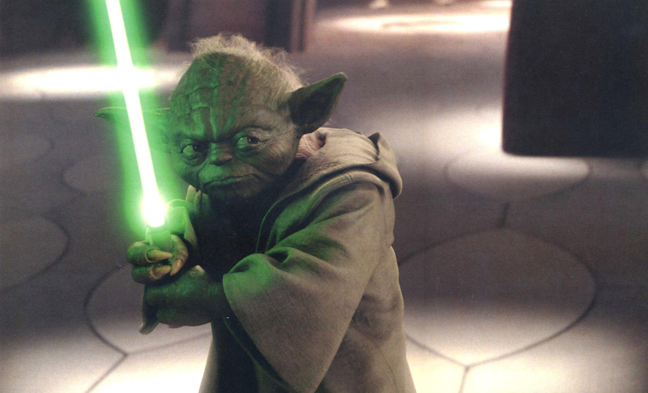 Yoda and his tiny lightsaber