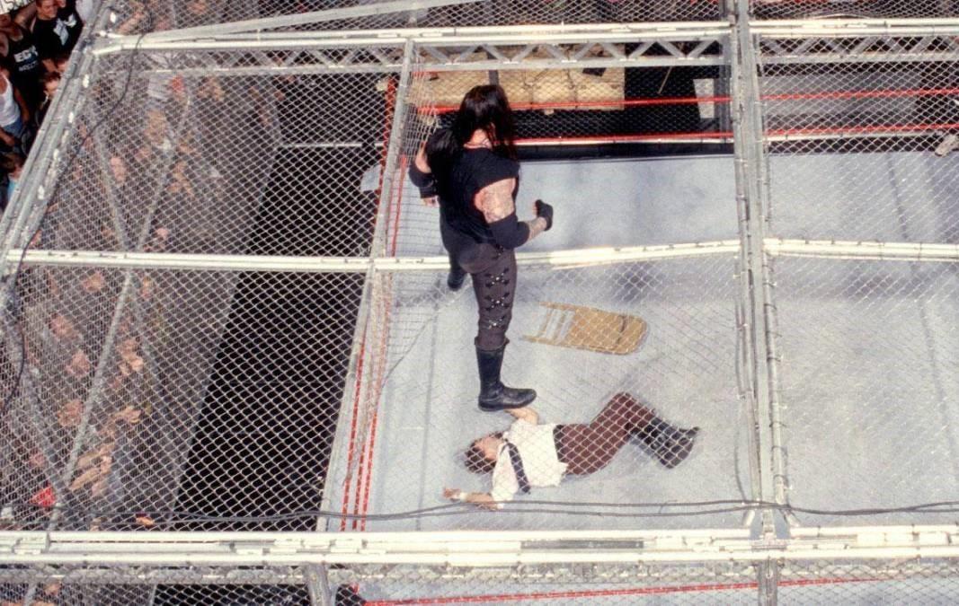 Mick Foley Falls Through Hell in a Cell