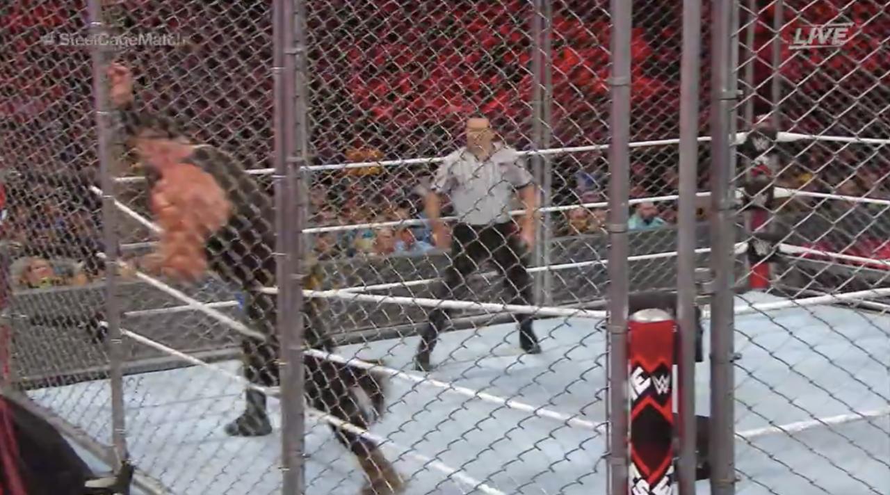 Strowman Runs Into The Cage