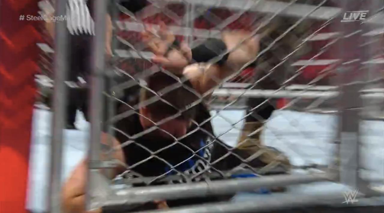 Strowman Bashes Owens' Head With The Cage Door