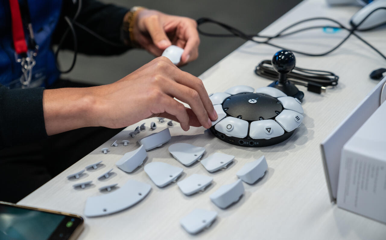 Customizing the Access controller during the preview event at PlayStation's US headquarters.
