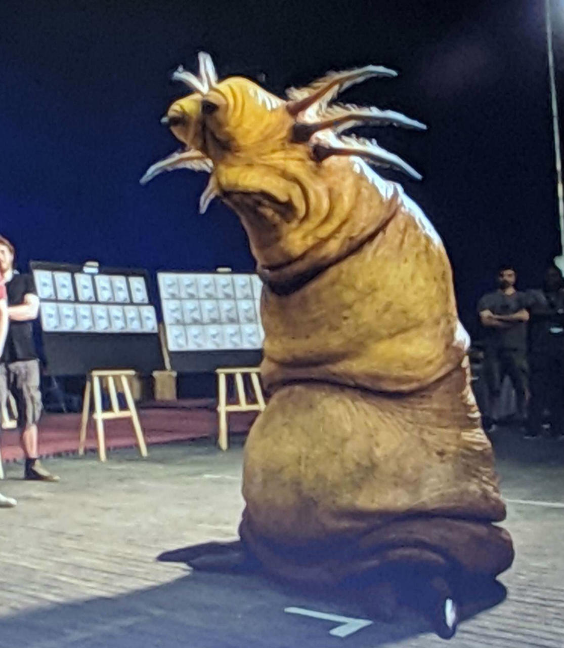 A behind-the-scenes image of an alien in the movie