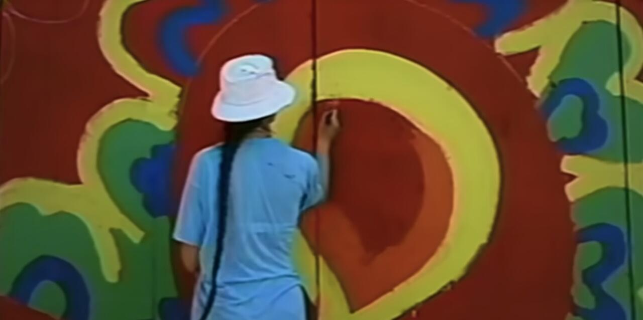 32. Painting in a bucket hat