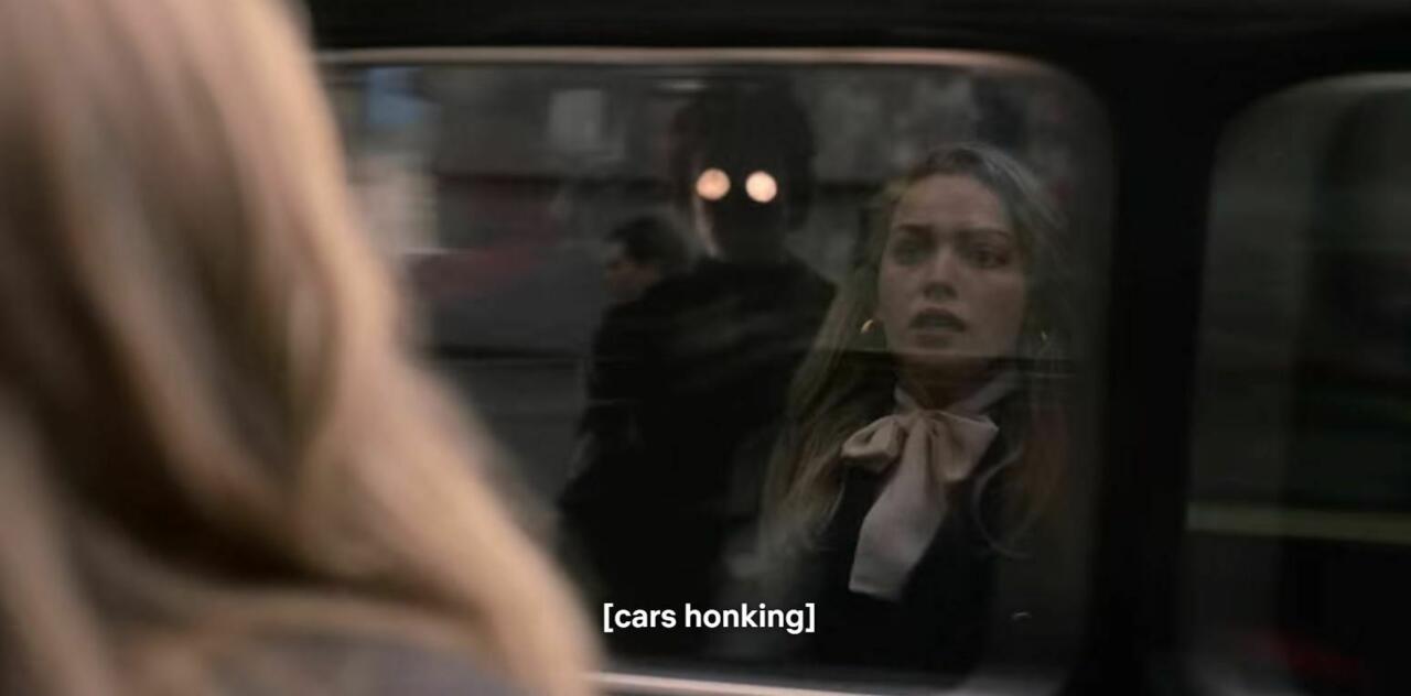 1.) Episode 1, 06:16, in the car window