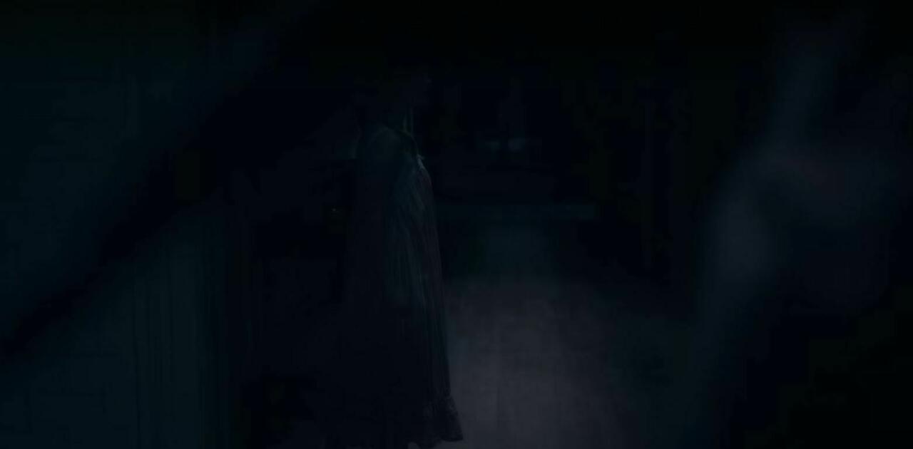 11.) Episode 1, 31:49, extremely close to the camera as Dani walks into the hall, the same figure later turns to watch