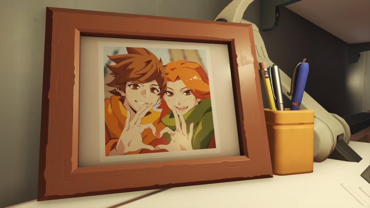 A framed photo of Tracer and Emily.