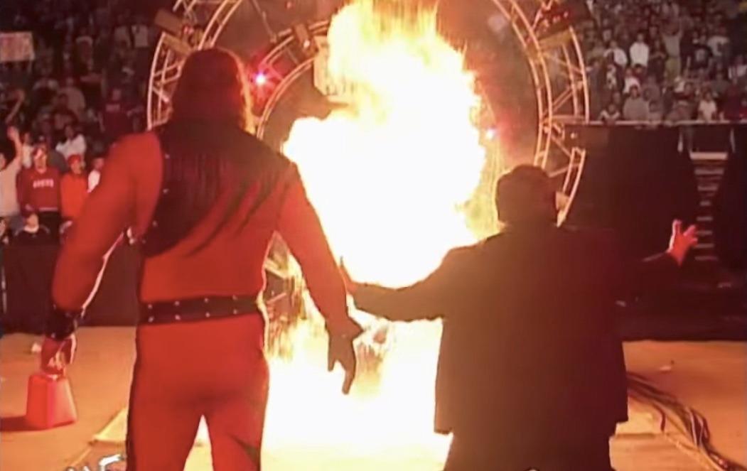Kane Lights The Undertaker's Casket On Fire